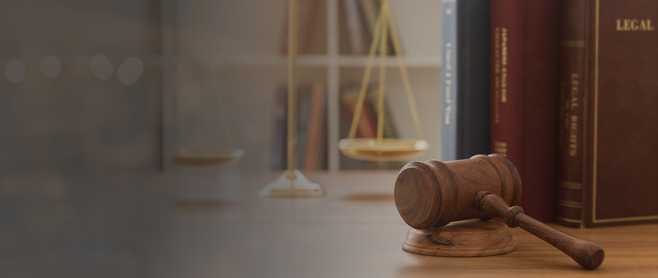 Gavel in front of legal books